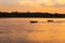 Mesmerizing soft sunset over the calm coastline of Danga bay with ships on the water