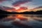 Mesmerizing sunset paints the sky above the tranquil lake