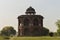 A mesmerizing view of architecture of small tomb at old fort from side lawn