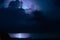 Mesmerizing view of a dramatic stormy cloudy sky at night with striking lightning