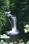 Mesmerizing view of the Geroldsau waterfall with a cascade of water and green trees, Germany