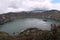 Mesmerizing view of Laguna Quilotoa in Quinta, Ecuador with a cloudy sky background