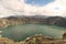 Mesmerizing view of Laguna Quilotoa in Quinta, Ecuador with a cloudy sky background