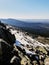 Mesmerizing view of the Penalara mountain in Spain covered in snow on a sunny day