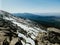 Mesmerizing view of the Penalara mountain in Spain covered in snow on a sunny day