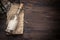 Message in a bottle with copy space on tropical wooden background with sea shells