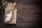 Message in a bottle on old papper with copy space on tropical wooden background with sea shells