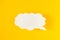 Message in the form of a cloud of paper on a yellow background, social networks, eddy, symbol