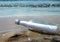 Message in a Glass Bottle on Sand Shore