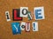 The message -I Love You- with cutout letters on corkboard