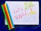 Message Lets Travel on white notebook with color markers. Closeup. Travel concept.