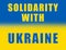 Message Solidarity with Ukraine on painted Ukrainian flag