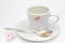 Messthetics aesthetic concept. A photo of the red lipstick marks on your coffee cup. Dirty empty white ceramic cup on the plate, s