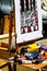 Messy artist`s easel with canvas painted