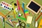 Messy and cluttered kids desk with school supplies. Education, studying and back to school concept. Child desk top view, copy