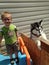 Messy face toddler boy with beautiful husky dog