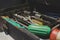 A messy full toolbox drawer in the old workshop