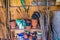 Messy gardening tools in tool shed stacked on shelf