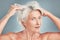 Messy hair, woman and senior model looking for hair care, wellness and salon hairstyle cut. Portrait of an elderly