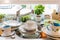 Messy kitchen counter with pile of dirty dishes in sink - Compulsive Hoarding Syndrome