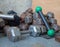 Messy pile of dumbbells in a gym corner