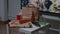 Messy table with empty beer bottles and food leftover on it in living room