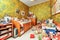 A messy and tidy child\\\'s bedroom with all kinds of things scattered on the floor