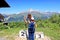 Mestia, Georgia, July 29, 2019. Observation place on the top of Mount Zuruldi. Tourists observe the nature of the Caucasian Mounta