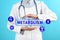 Metabolism concept. Doctor with stethoscope on blue background, closeup