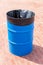 Metal barrel with plastic bag for waste