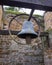 A metal bell hanging outside