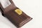 Metal bitcoins in brown leather wallet. Bitcoin - modern virtual