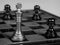 Metal black and white chess on a chessboard