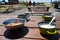 Metal camping utensils on a wooden table. Picnic in nature.