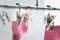 Metal clothes pegs on hanger with pink socks  it looks like little metal heart. Love and valentine day concept