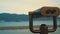 Metal coin operated gray telescope isolated on a view of a beautiful panoramic scenery, blue sky, sea water and