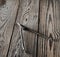 Metal compasses on a wooden table