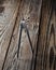 Metal compasses on a wooden table