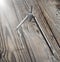 Metal compasses on a wooden table