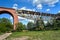 Metal construction of a destroyed railway viaduct against the sky