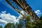 Metal construction of a destroyed railway viaduct against the sky