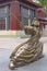 Metal copper statue of woman holding sword posing Chinese Kung Fu posture in ancient traditional dress. Dayan Pagoda, Xian China