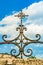 The metal cross on top of the Mission Concepcion church in San Antonio, Texas