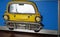 A metal Cut out of a yellow American Taxi cab