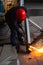 Metal cutting, steel with acetylene torch in factory. wear protective gloves when working with fire flakes