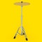 Metal cymbal on a stand on yellow. 3d render of musical percussion instrument