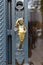 Metal door with gold plated colour handle in human body form shape for art architecture
