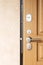 Metal door with lock. Modern style door handle on natural wooden door