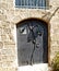 Metal door with ornament in the form of a grapevine. Yaffo, Israel