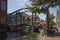 Metal draw bridge over the the Oude Rijn canal decorated with flowers